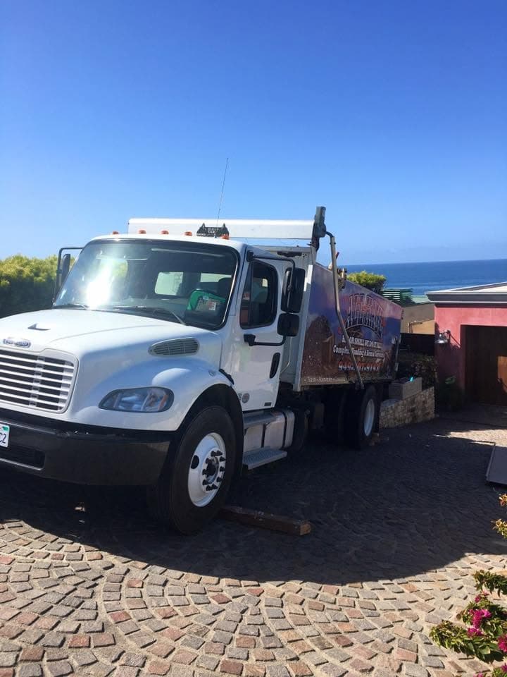All Haul truck parked with the Pacific coastline in the background