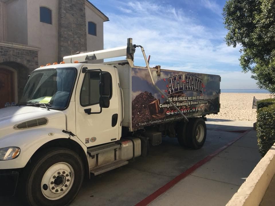 All Haul truck parked at a beachfront home