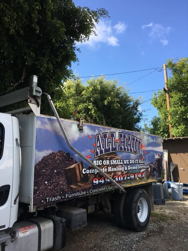 All Haul truck bed loaded with construction debris