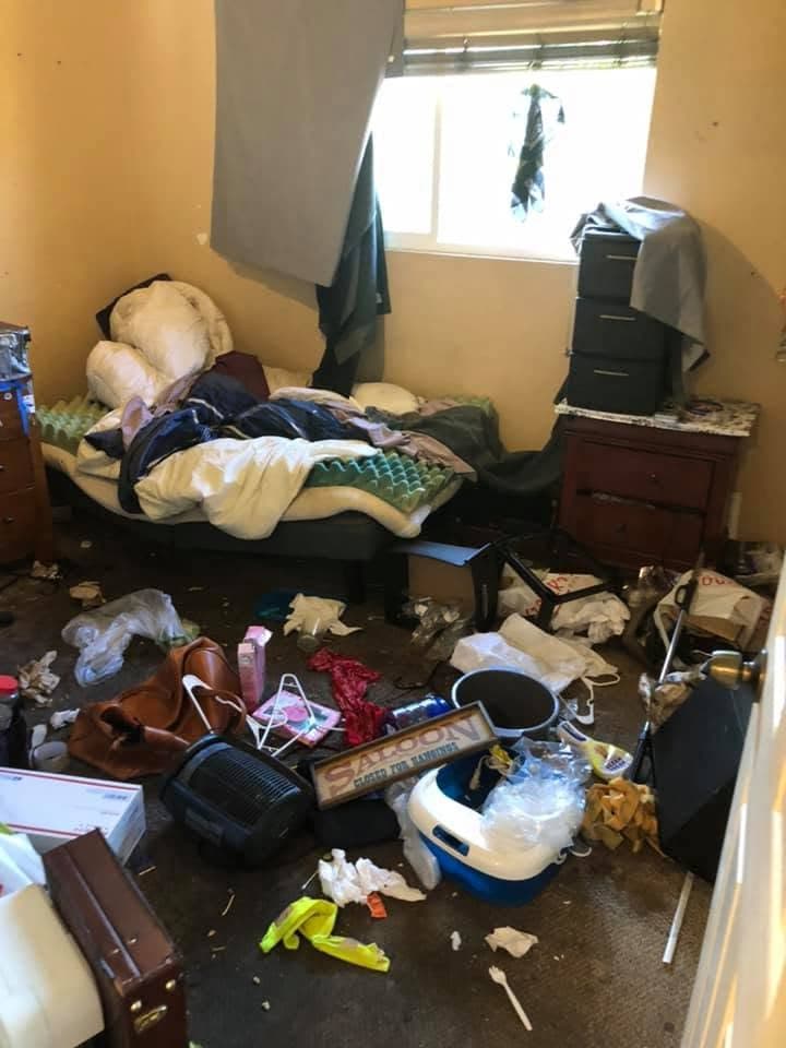 Cluttered bedroom before a full cleanout