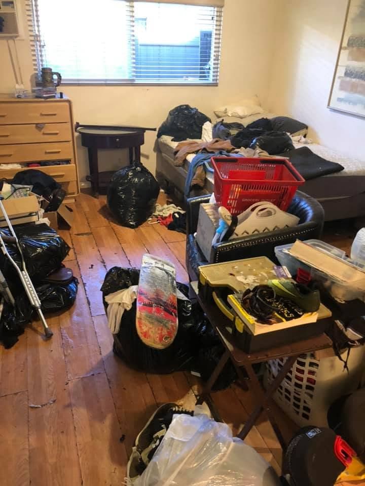 Room packed with bagged belongings before a cleanout