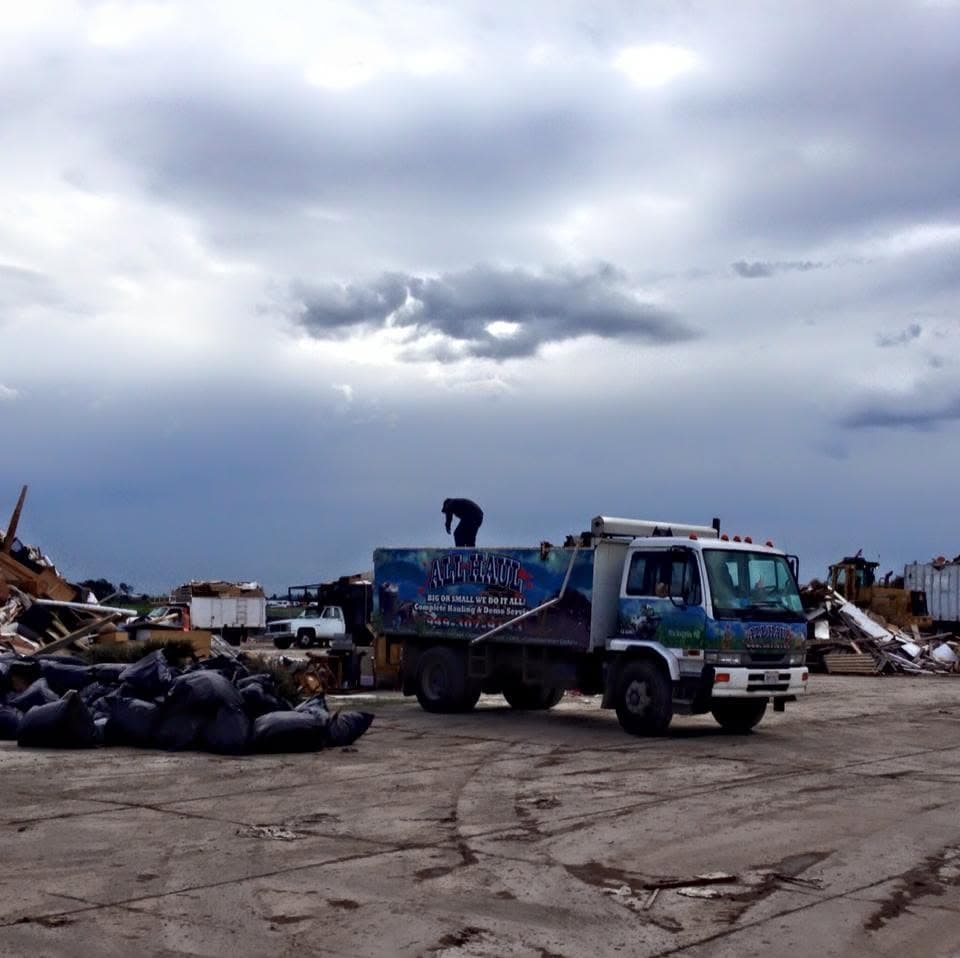 All Haul truck being unloaded at the debris yard