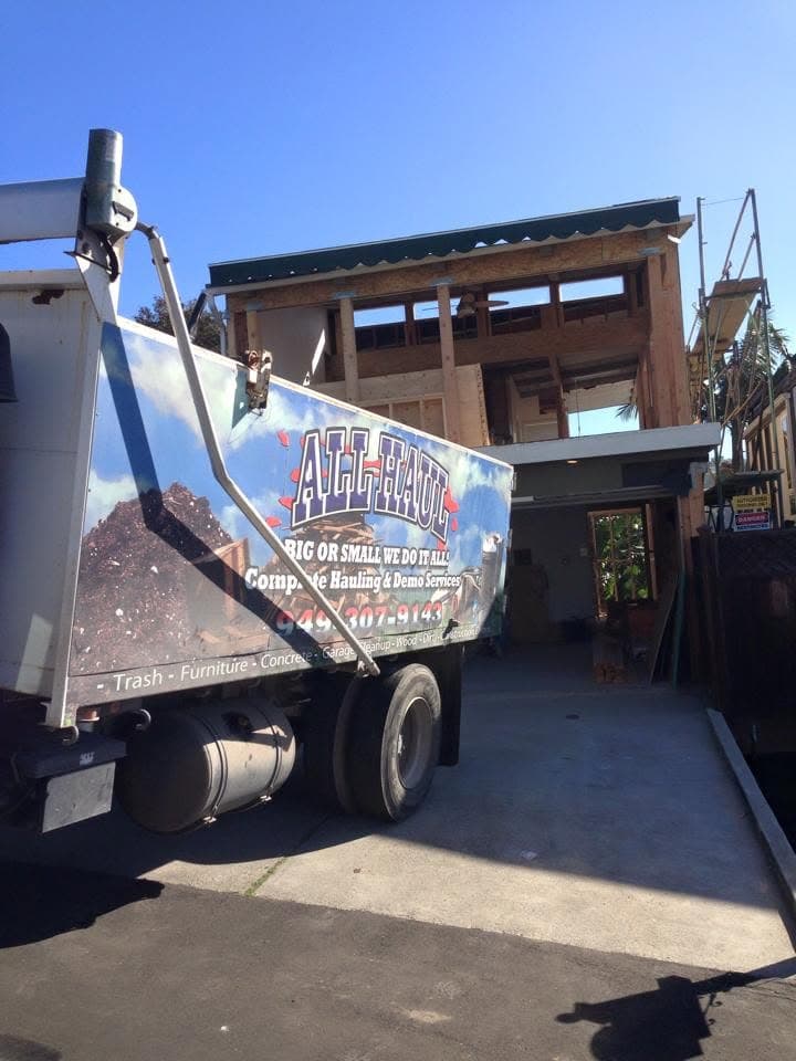 All Haul truck parked at a home under construction