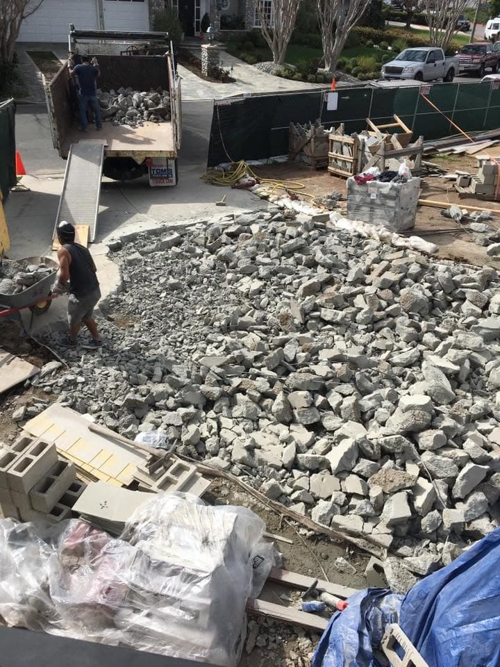 Crew breaking up and hauling away concrete