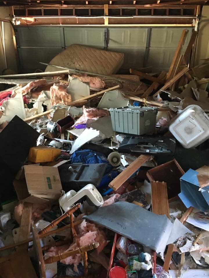 Garage completely full of debris before a cleanout