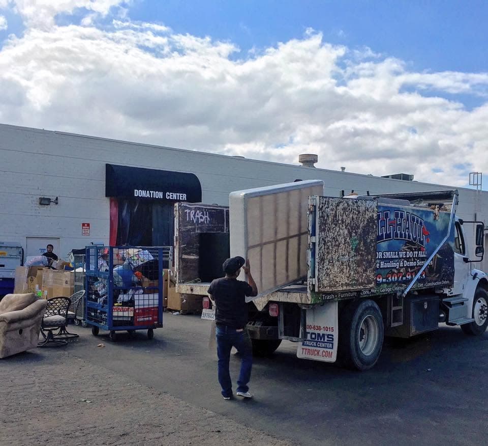 Crew unloading items at a donation center