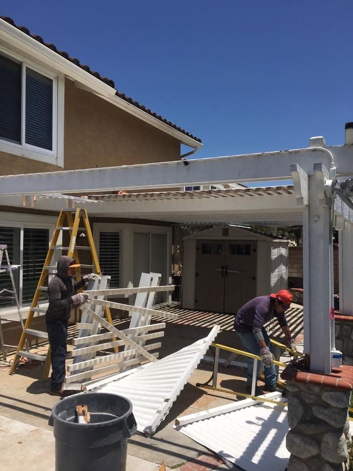 Crew removing an old patio cover