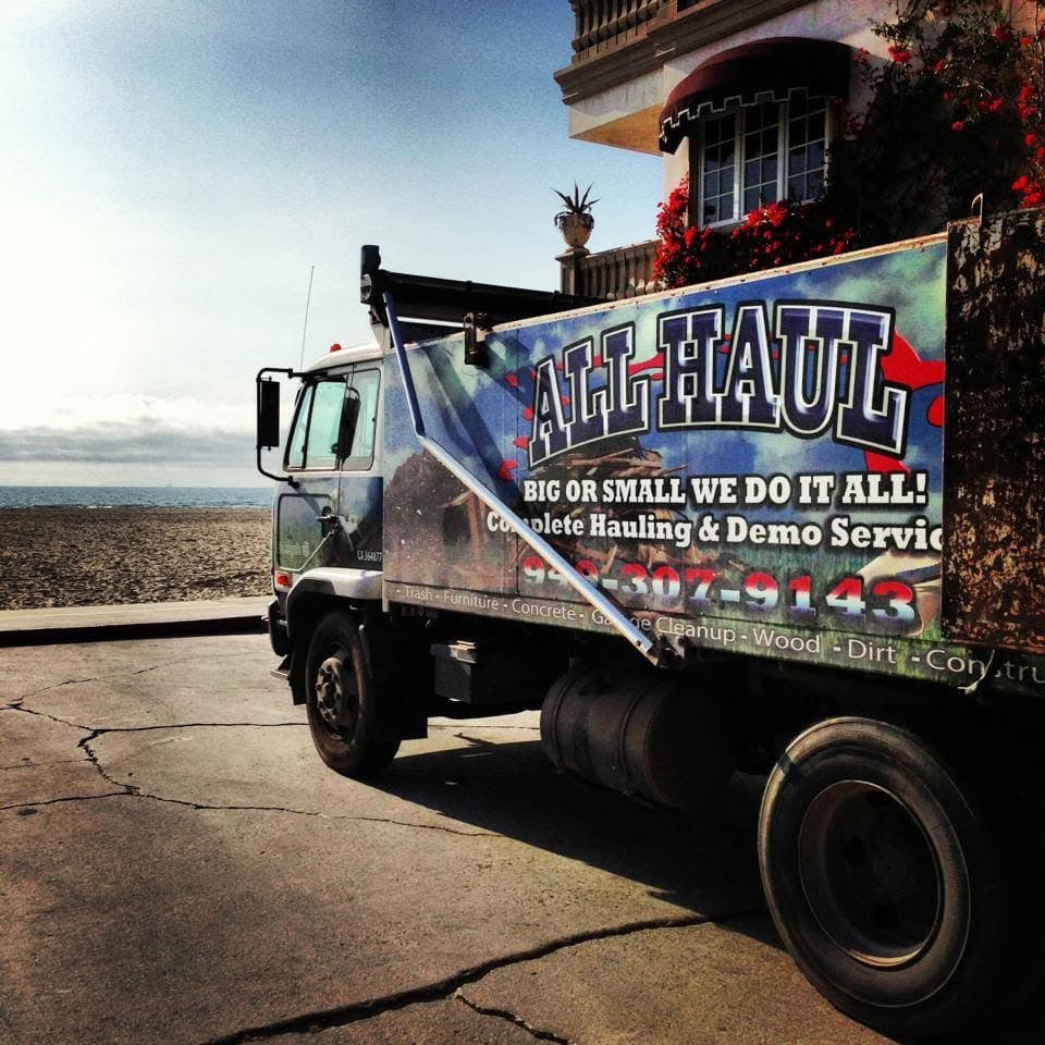 All Haul truck parked at a coastal home